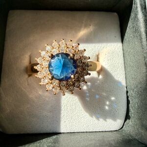 NEW! Pretty Bird Jewelry Gold Ring with Blue Center Stone & Halo of Clear Stones